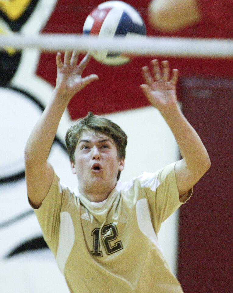 St. Francis' libero Carl D'Aguiar hits a serve into play against La Canada in a non-league boys volleyball match at La Canada High School on Monday, March 10, 2014. St. Francis won the match 3-1.