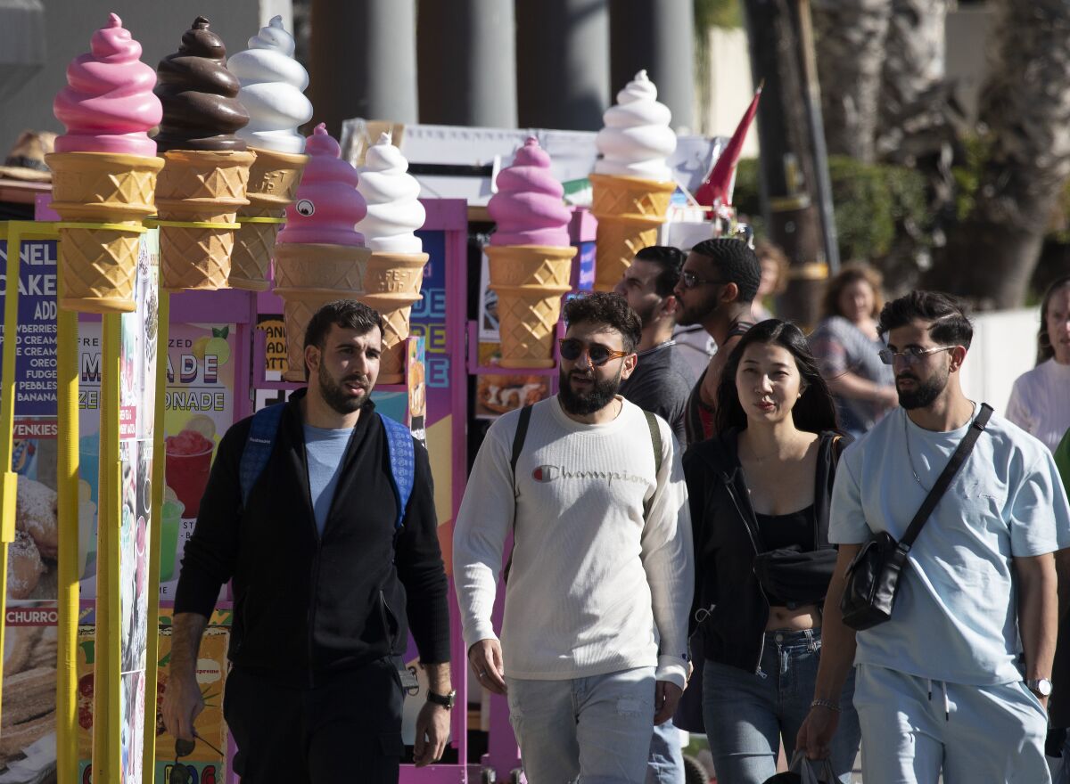 People visit Venice Beach.