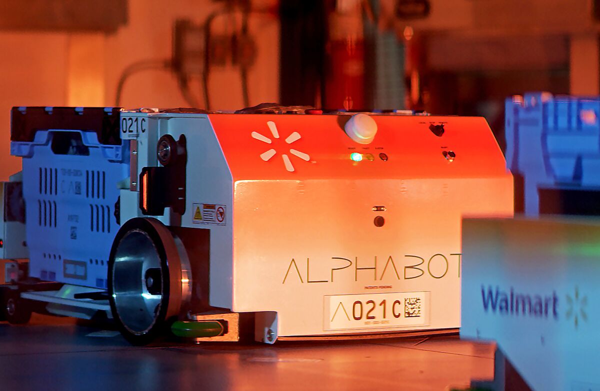 Walmart's Alphabot, an automated, 20,000-square-foot warehouse that could make its grocery pickup service faster and more efficient.