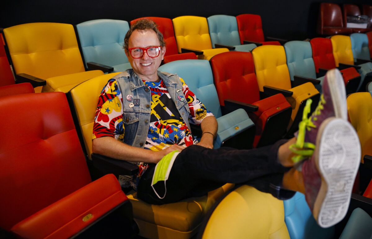 Matt M. Morrow, executive artistic director of Diversionary Theatre, sits in the theater's new seats.