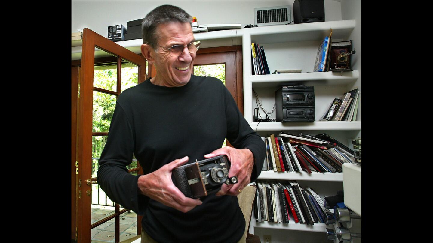 Leonard Nimoy in his Bel Air home in 2002, inside his studio holding his first camera, a No.1 Autographic Kodak Jr.