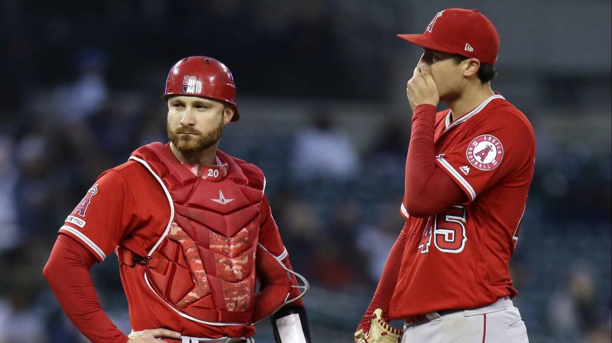 Angels catcher Jonathan Lucroy, left, and pitcher Tyler Skaggs during a game against the Detroit Tigers on May 8.