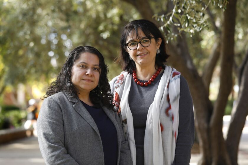 LOS ANGELES, CALIFORNIAÑFEB. 5, 2020ÑLeisy Abrego, left, and Ceciliar Menjivar, right, are two leading Salvadoran scholars on Central American migration. "In our world, we're obsessed with accuracy, with data and nuance. We try to get as close as possible to the lives of the people we study," said Cecilia Menjivar, Professor of Sociology at UCLA who has studied Central American migration for 25 years. Photographed on the campus of UCLA on Feb. 5, 2020. (Carolyn Cole/Los Angeles Times)