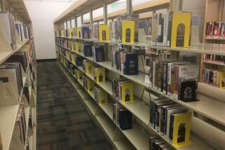 A non-fiction section of the Escondido Library seen in a photo taken in March.