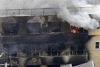 FILE - Smoke billows from a Kyoto Animation building in Kyoto, western Japan, on July 18, 2019. A murder trial began Tuesday, Sept. 5, 2023 for the 2019 deadly arson attack on the Kyoto animation studio which left 36 people dead, and the defendant who needed time to recover from serious burns that nearly killed him pleaded guilty to the deadliest crime in decades, officials and media reports said. (Kyodo News via AP, File)