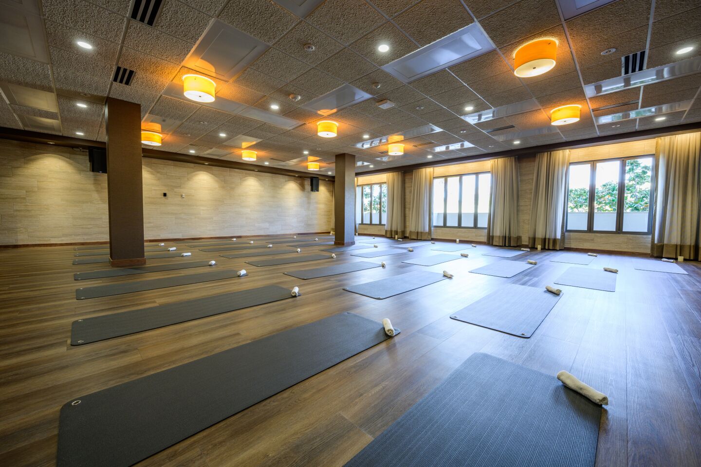 The large yoga studio hosts a variety of classes.