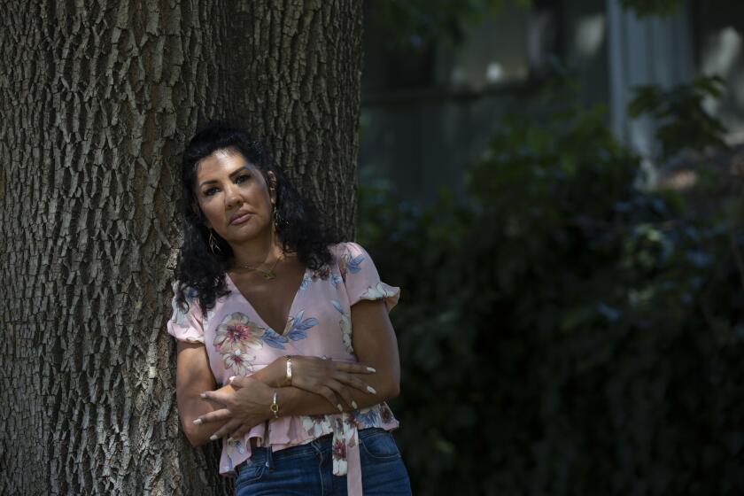 WINNETKA, CALIF. - AUGUST 12, 2019: Mia St. John spends time at Runnymeade Park on Monday, Aug. 12, 2019 in Winnetka, Calif. where she used to find her son Julian St. John who used to be homeless due to his schizophrenia. He was admitted to a psychiatric facility for his safety, but he killed himself there. Mia has made it her life's goal to improve psychiatric care. (Liz Moughon / Los Angeles Times)