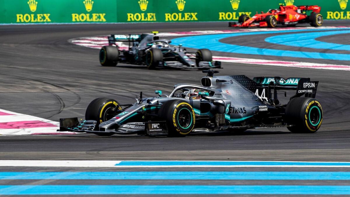 Formula One driver Lewis Hamilton leads the pack through a series of curves during the French Grand Prix on Sunday.