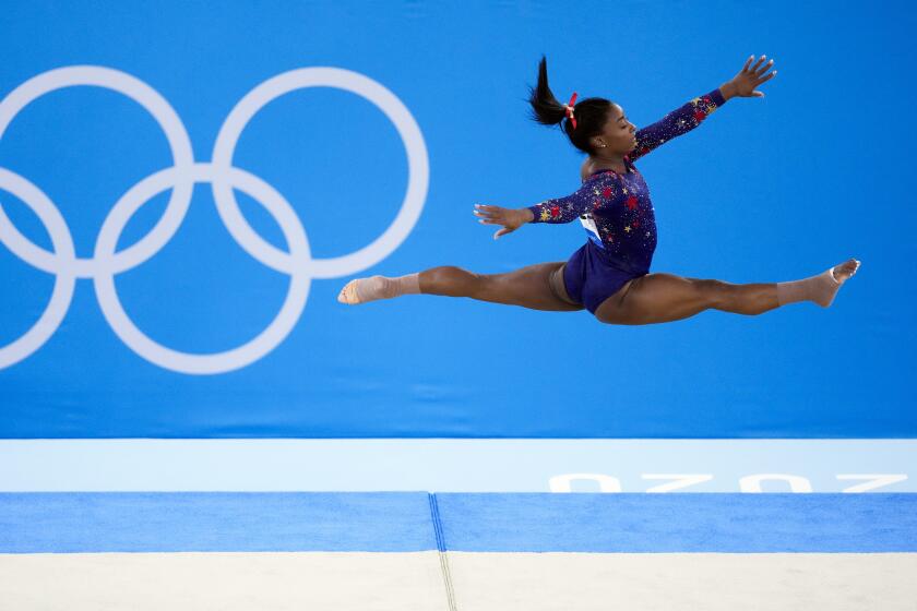 Simone Biles, of United States, performs her floor exercise routine.