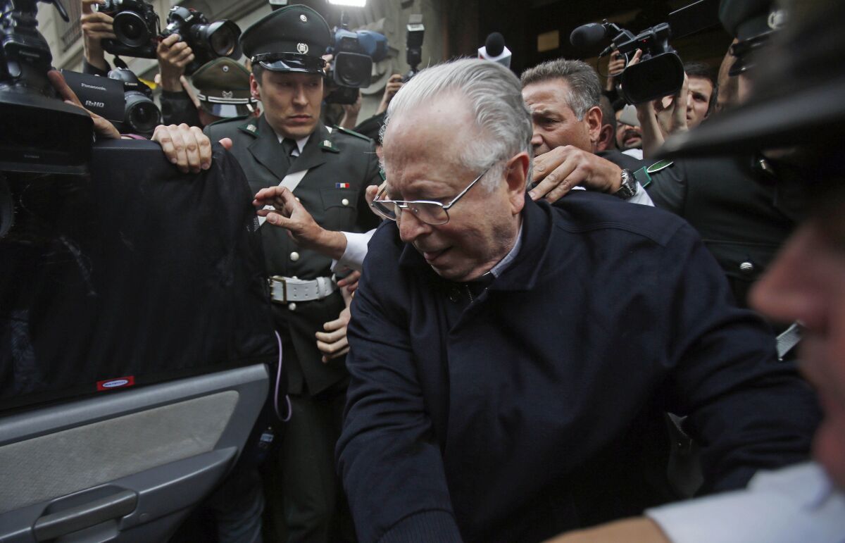 Fernando Karadima is escorted from court in 2015 in Santiago, Chile.