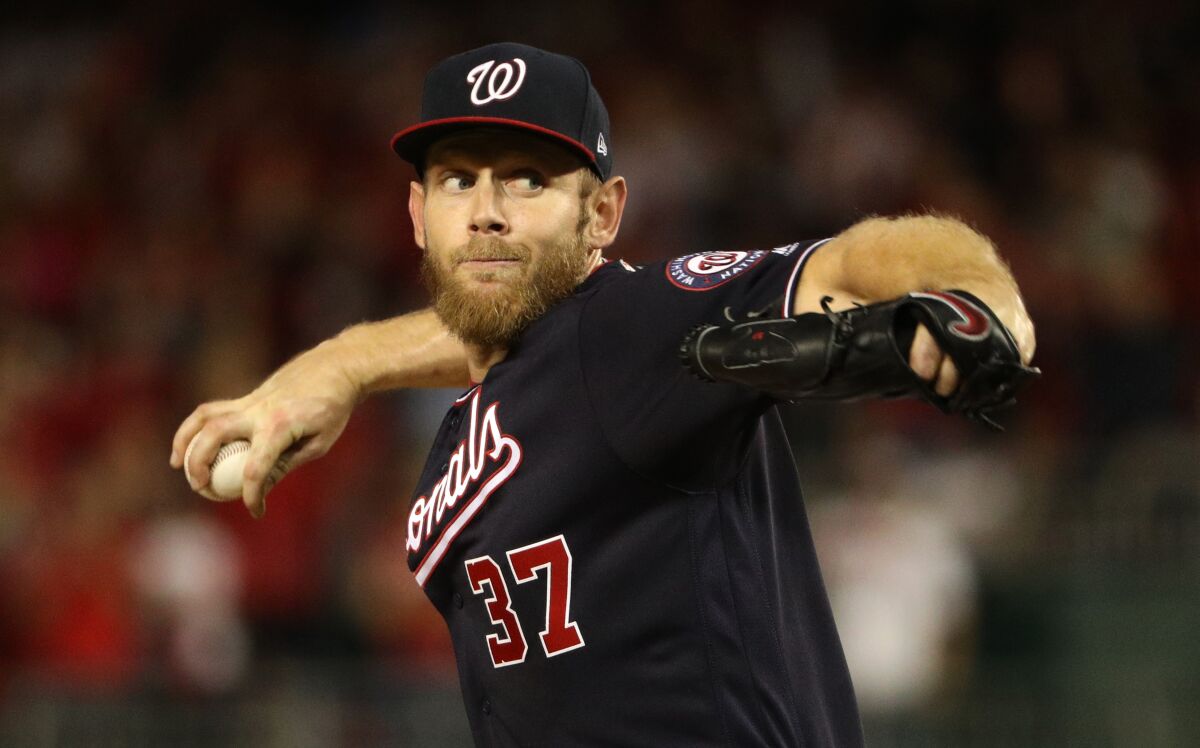 Stephen Strasburg delivers a pitch during Game 3 of the NLCS.