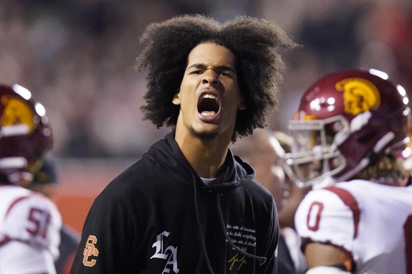 Southern California linebacker Eric Gentry (18) reacts on the sidelines after being injured.