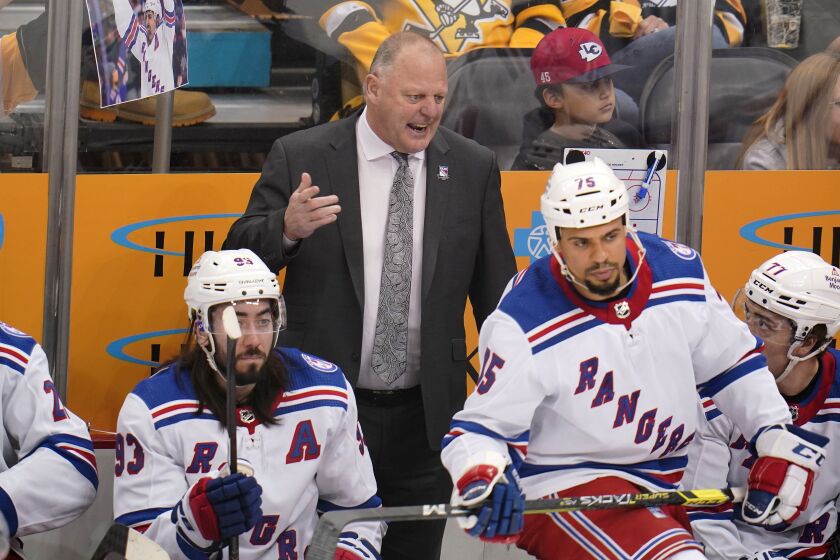 FILE - New York Rangers head coach Gerard Gallant stands behind his bench during Game 6 of an NHL hockey Stanley Cup first-round playoff series against the Pittsburgh Penguins in Pittsburgh, Friday, May 13, 2022. Gallant, heading into his second year at the helm, is ready for his team to put last season in the rearview mirror and again focus on the task in front of them. (AP Photo/Gene J. Puskar, File)