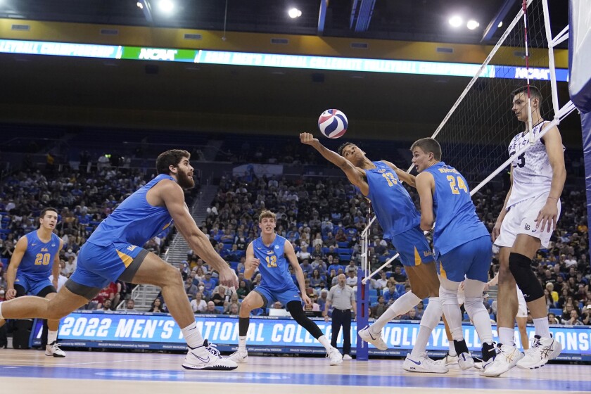 UCLA middle blocker Merrick McHenry reaches back for the ball.