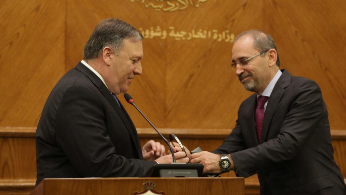 Secretary of State Mike Pompeo, left, and Jordan's Foreign Minister Ayman Safadi attend a press conference in Amman, Jordan, April 30, 2018.