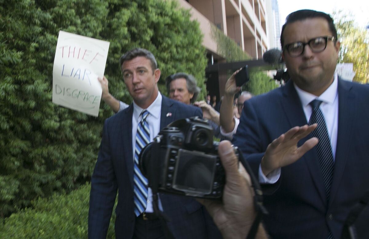 50th congressional district representative Duncan D. Hunter, left, left the Federal courthouse in San Diego in August after he pleaded not guilty to charges that he and his wife Margaret Hunter stole $250,000 in campaign contributions.