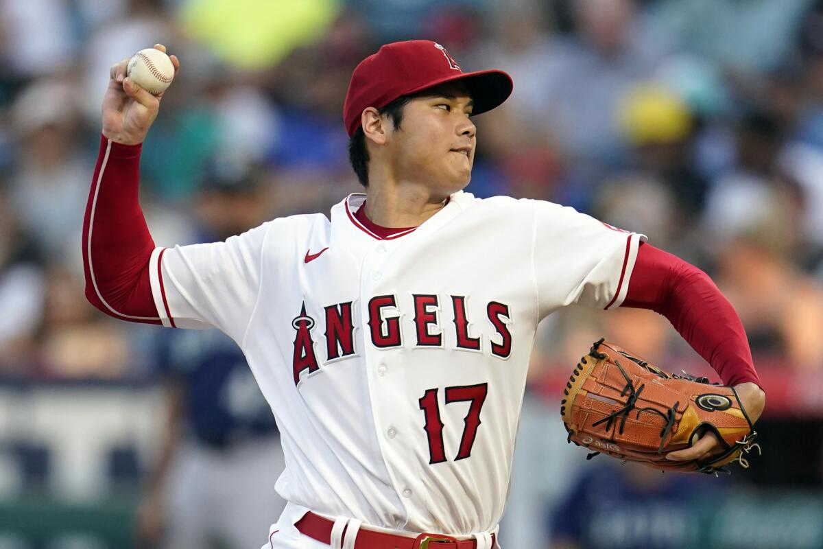 Angels pitcher Shohei Ohtani throws to a Seattle Mariners batter.