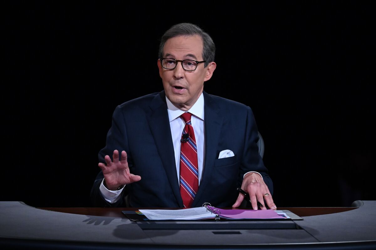 FILE - Moderator Chris Wallace of Fox News speaks as President Donald Trump and Democratic presidential candidate former Vice President Joe Biden participate in the first presidential debate in Cleveland on Sept. 29, 2020. Wallace will host a Sunday night interview show for CNN starting this fall. (Olivier Douliery/Pool via AP, File)