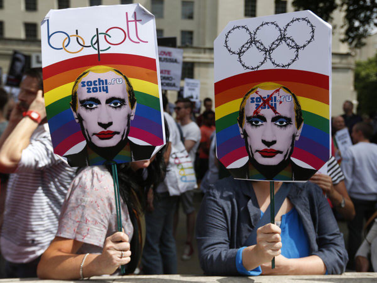 Hundreds of gay rights activists protested in London on Saturday, brandishing doctored images of Russian President Vladimir Putin as they called for boycotting the 2014 Olympic Winter Games in Sochi in protest of a law targeting gays.