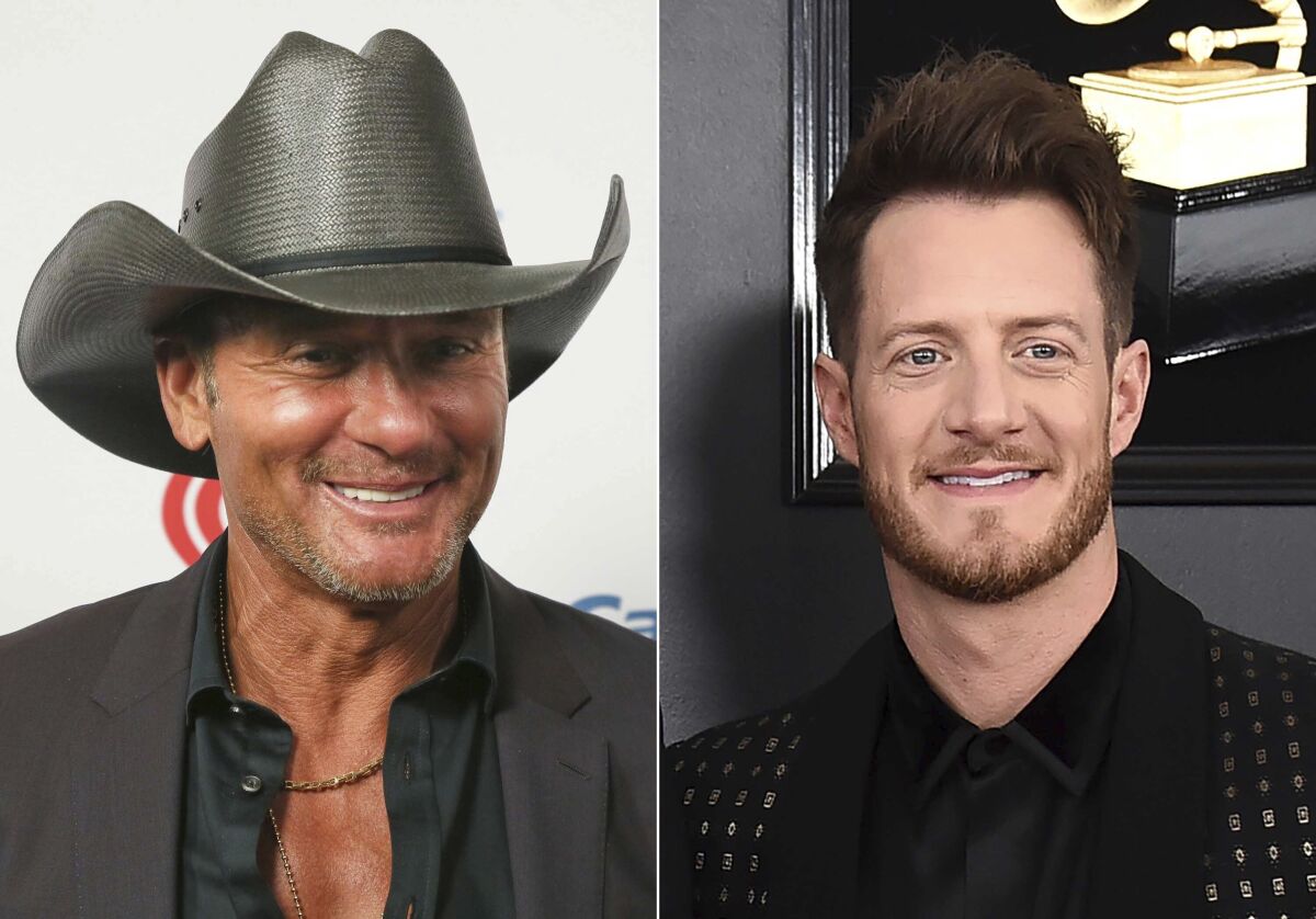 This combination photo shows Tim McGraw at the iHeartCountry Festival in Austin, Texas on May 4, 2019, left, and Tyler Hubbard of the duo Florida Georgia Line at the 61st annual Grammy Awards in Los Angeles on Feb. 10, 2019. Hubbard and McGraw are asking people to walk a mile in someone else's shoes in a call for unity on their new duet “Undivided." Hubbard wrote the song while isolating on his tour bus after testing positive for COVID-19 last year. He said the division in America in 2020 weighed heavily on his heart as he wrote the song. McGraw said the song isn't political, but makes a case for empathy instead of disagreement. (AP Photo)