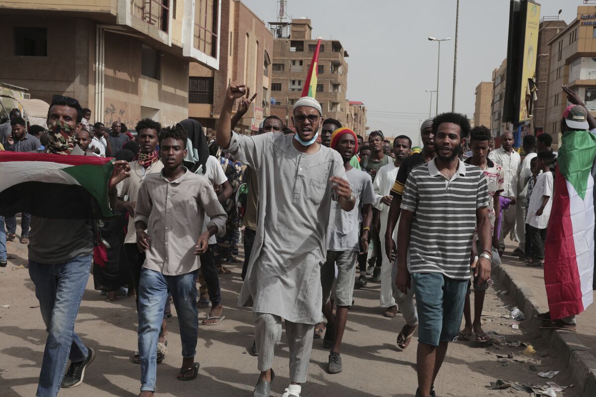 Anti-military protesters march on Friday, July 1, 2022 in Khartoum, Sudan, a day after nine people were killed in demonstrations against the country’s ruling generals. (AP Photo/Marwan Ali)