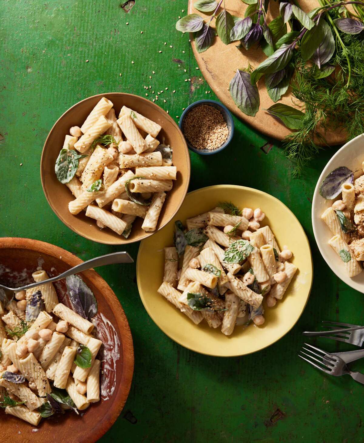 Tahini-Herb Pasta Salad in colorful bowls