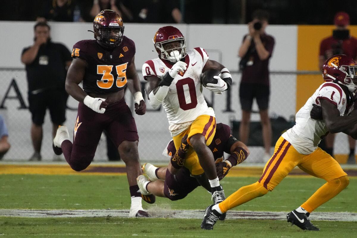 USC running back MarShawn Lloyd carries the ball against Arizona State in the first half Saturday.