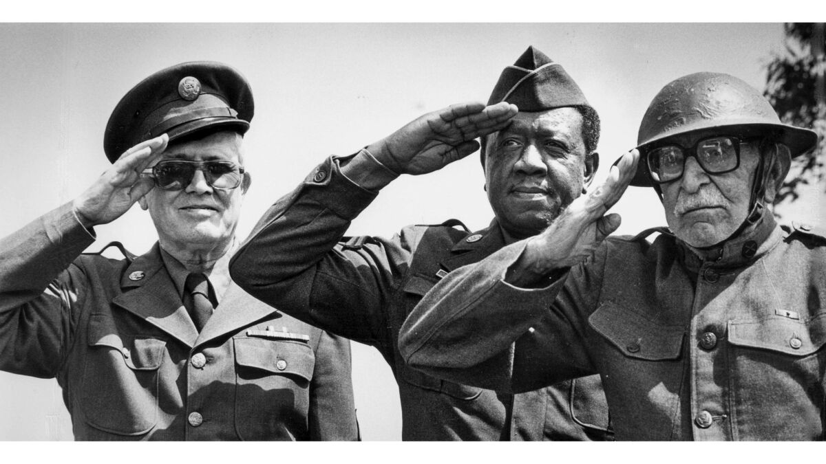 July 23, 1986: Three veterans salute during a protest against sale of Veterans Administration land in West Los Angeles.