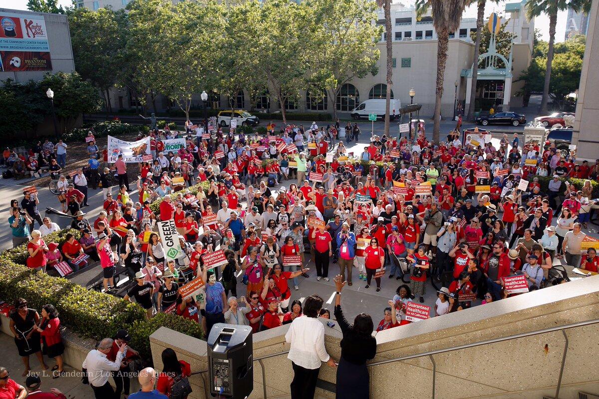 Supporters of single-payer healthcare rally outside the California Democratic Party convention Sacramento on Friday.