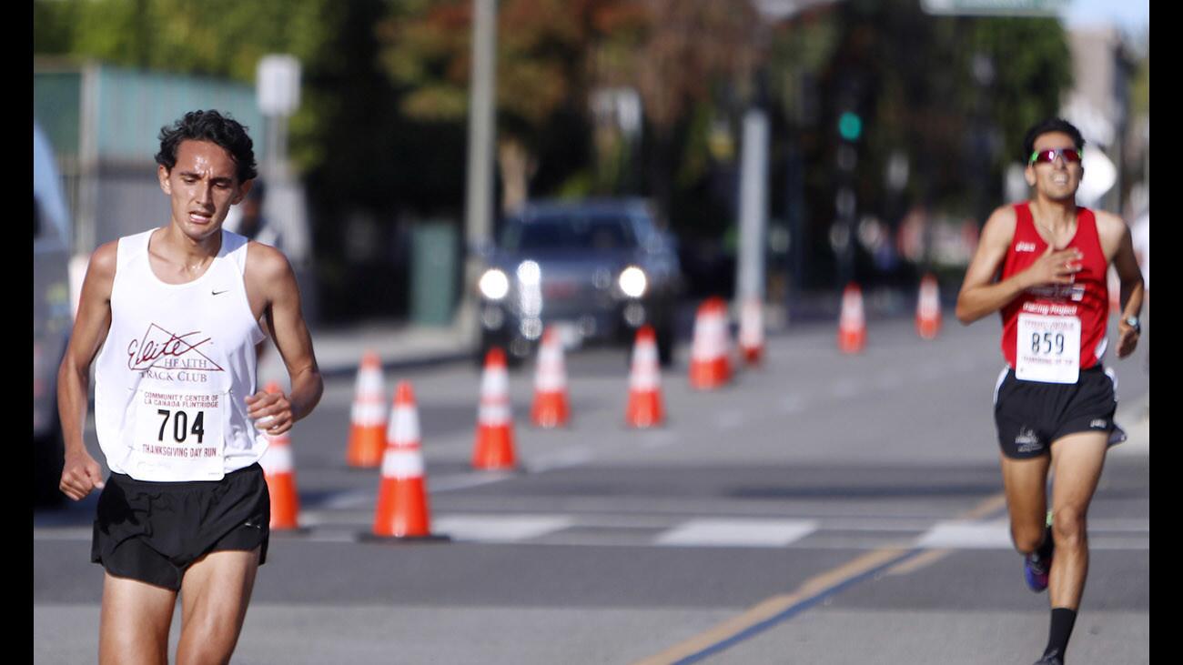 Philip Thomas of La Crescenta was the first male to finish the Thanksgiving Day Run & Food Drive, presented by the Community Center of La Caada Flintridge, in La Cañada Flintridge, on Thursday, Nov. 23, 2017. Runner #859 Phillip Gonzalez came in second place. About 1,600 runners participated in the 5K and 1-mile fun run.