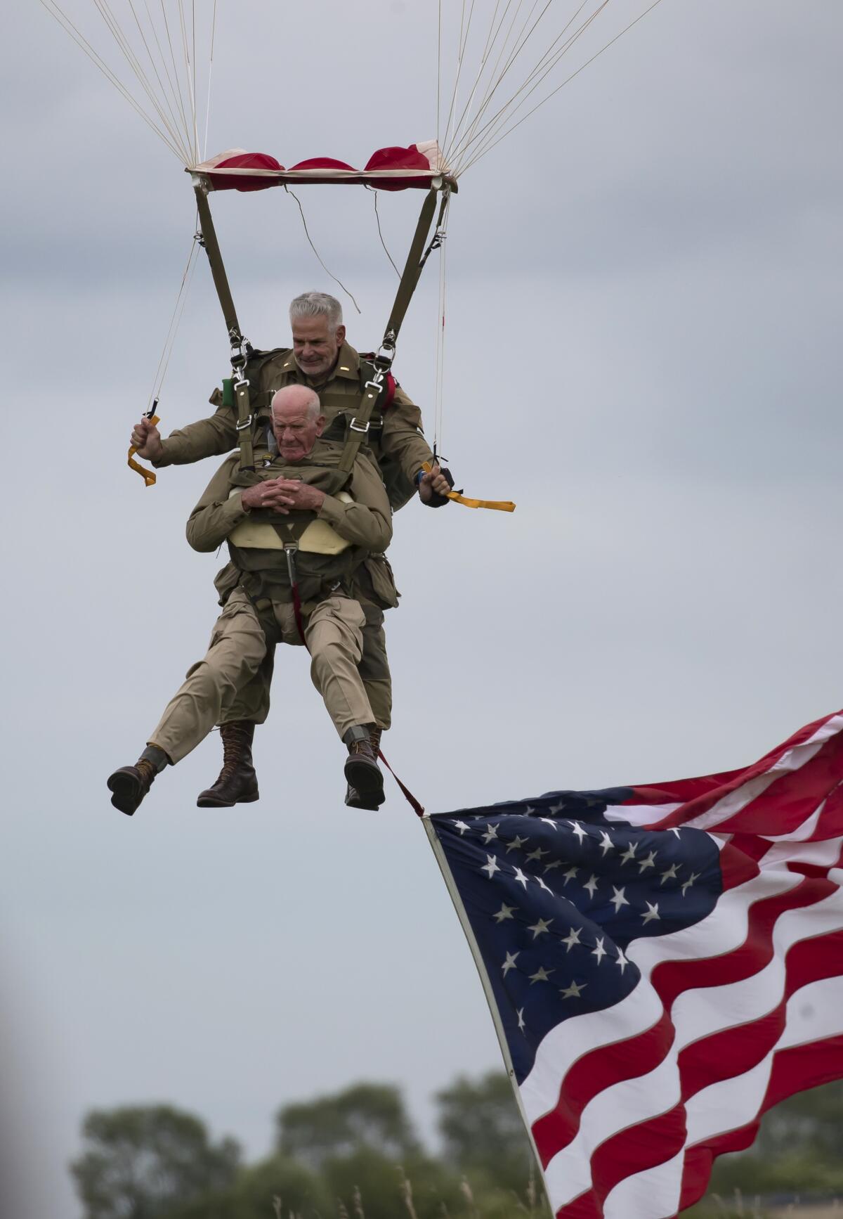 Tom Rice parachutes in a tandem jump into a field in Normandy, France, on June 5, 2019.