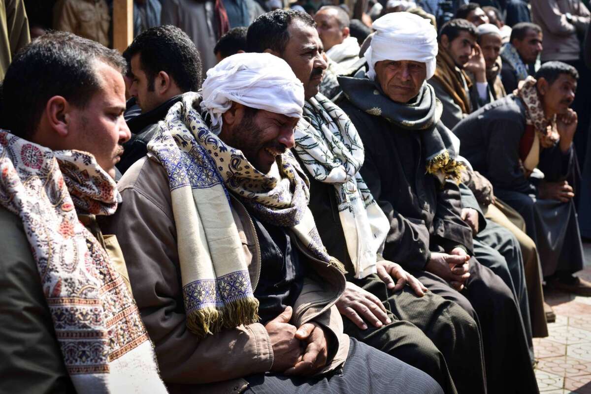 Relatives of Egyptian Coptic Christians killed by Islamic State militants in Libya react after hearing the news.