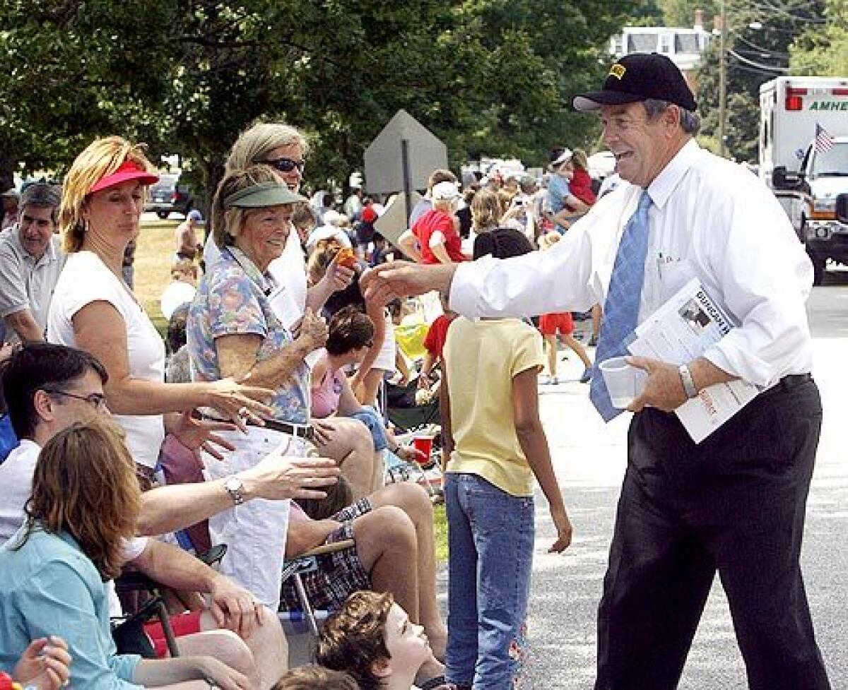 Rep. Duncan Hunter (R-El Cajon) seeks support at a Fourth of July parade in Amherst, N.H. If I get a chance to be president ¼ that will be a pretty good day job, he says. He faces a lack of cash and name recognition.