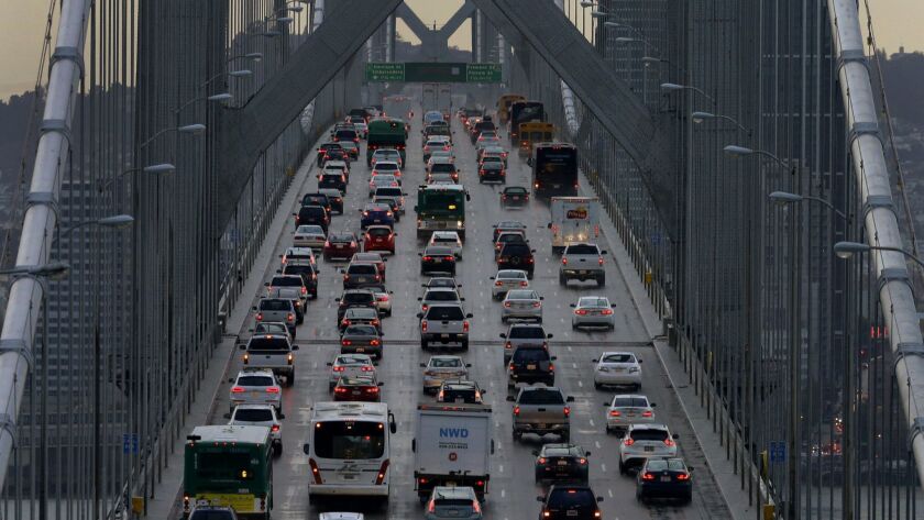 Vehicles make their way westbound on Interstate 80 across the San Francisco-Oakland Bay Bridge in San Francisco on Dec. 10, 2015.