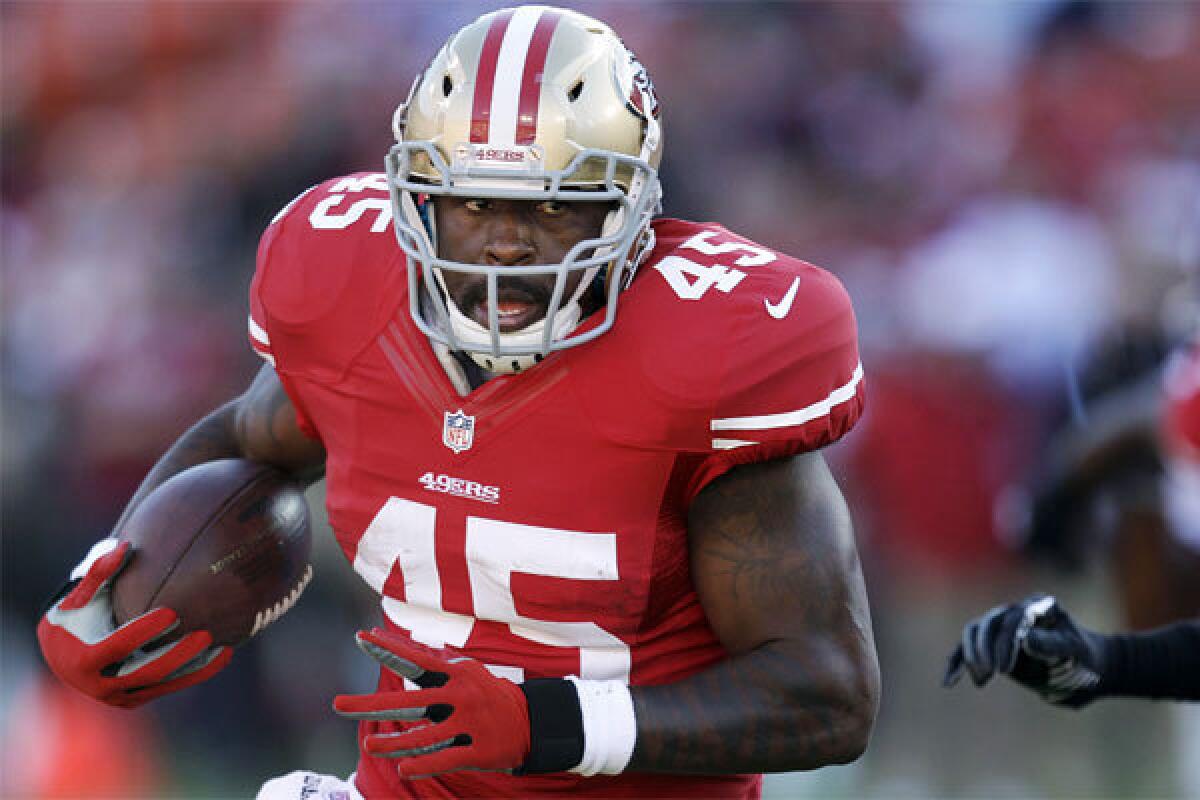 Brandon Jacobs, shown running for San Francisco during the exhibition season, was suspended Monday by the 49ers.