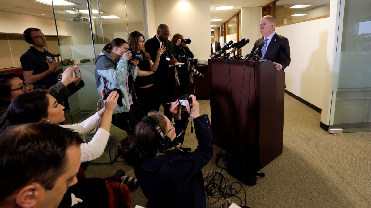 Seattle Mayor Ed Murray reads a statement to members of the media on April 7.