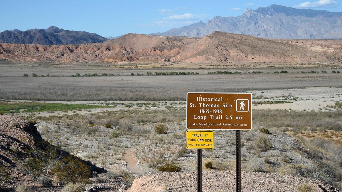 A sign showing the trail to the ghost town of St. Thomas, Nev..