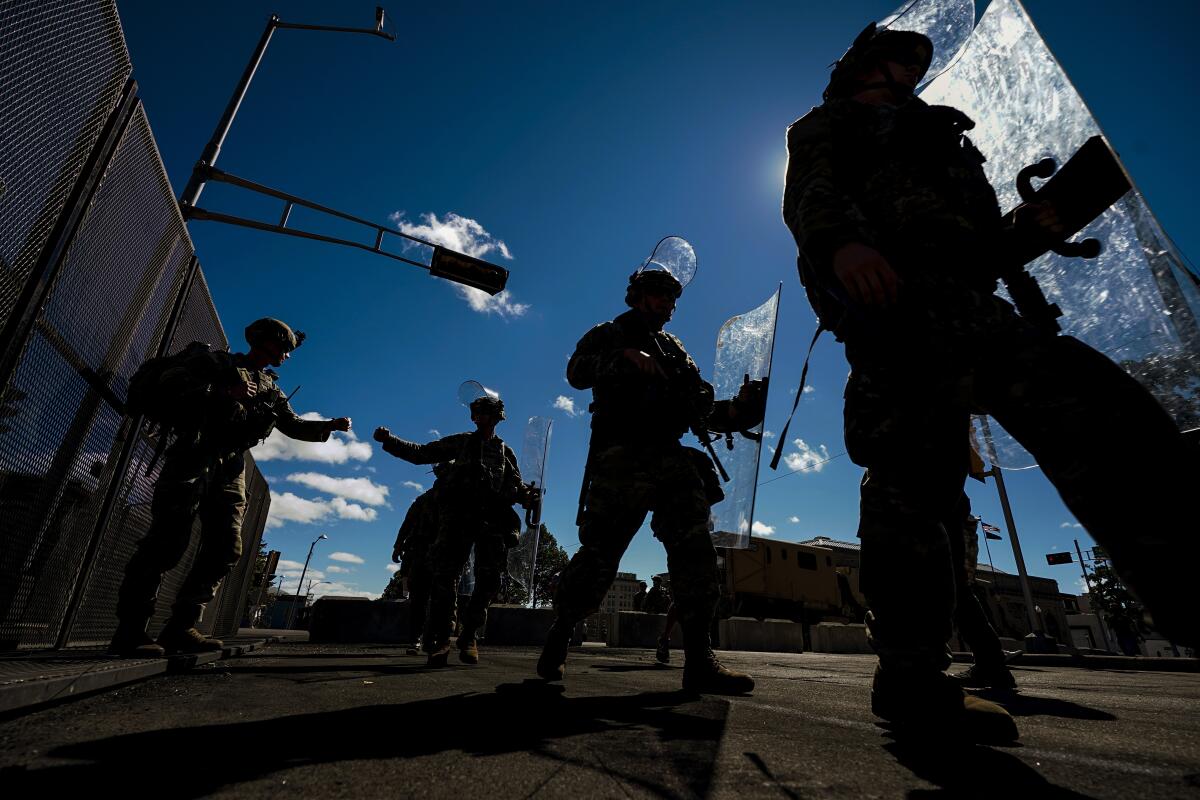 Wisconsin National Guard troops arrive at the Kenosha County courthouse on Aug. 30.