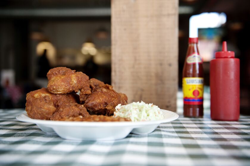 Wait a few seconds before diving in to your plate at Gus's Fried Chicken, which comes burning hot and powerfully good.