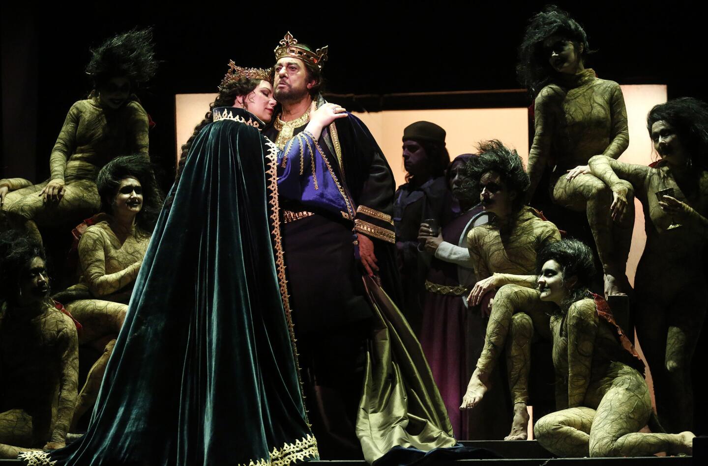 Plácido Domingo portrays Macbeth and Ekaterina Semenchuk is Lady Macbeth in Los Angeles Opera's new production of Verdi's "Macbeth." Meddlesome witches seem to direct the action in Darko Tresnjak's staging.