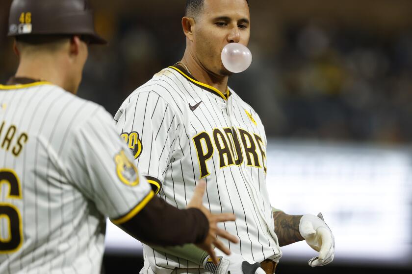 San Diego CA - May 14: San Diego Padres' Manny Machado blows a bubble after hitting into a double play against the Colorado Rockies in the sixth inning at Petco Park on Tuesday, May 14, 2024 in San Diego, CA. (K.C. Alfred / The San Diego Union-Tribune)