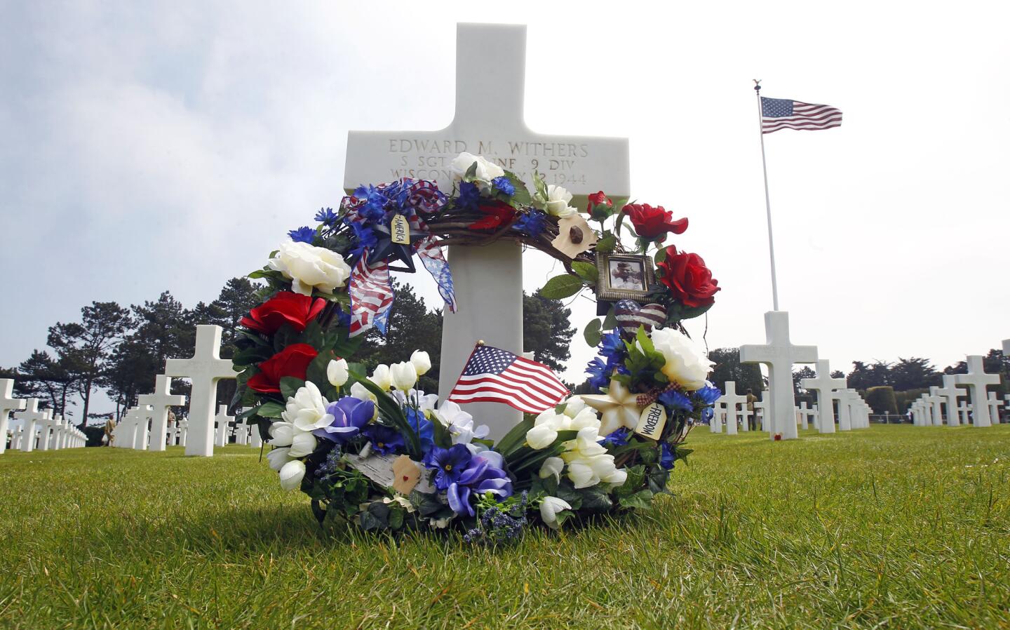 A wreath on the grave of Sgt. Edward M. Withers from Wisconsin during commemorations of the 69th anniversary of the D-day landings, at the Colleville American military cemetery, in Colleville sur Mer, France.