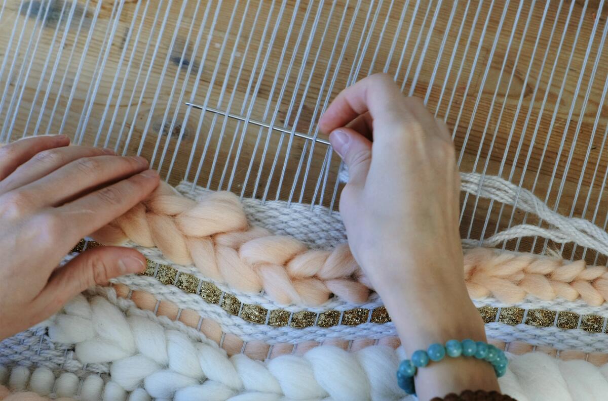 A stock photo of weaving on a loom.