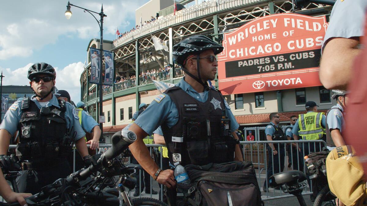 Police stand outside of Wrigley Field in Steve James "City So Real."