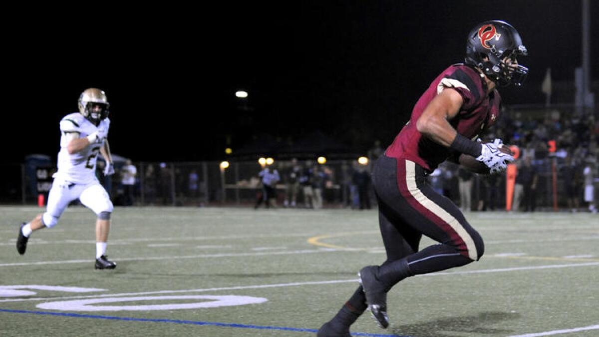 Oaks Christian receiver Michael Pittman is wide open for a touchdown during a game against Westlake Village on Oct. 23.