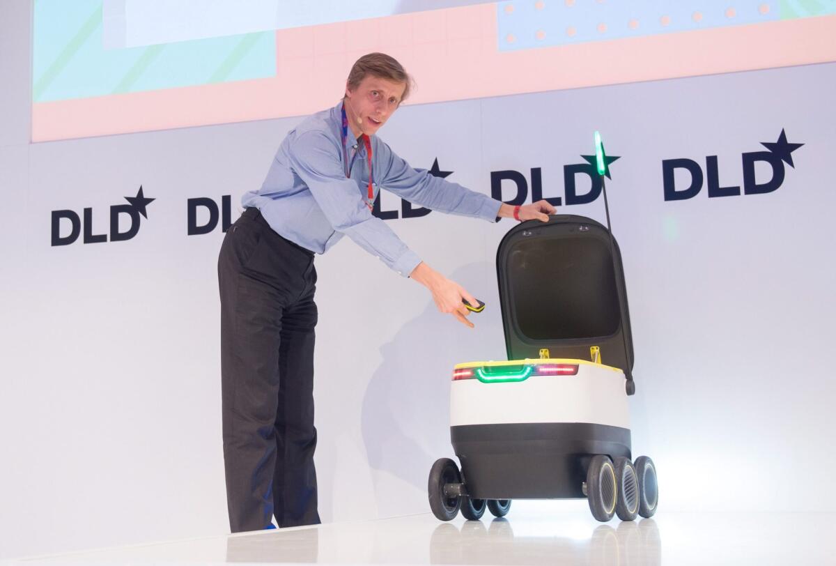 Ahti Heinla of Starship Technologies presents a wheeled delivery robot at the Digital-Life-Design conference in Munich, Germany on Jan. 18, 2016.