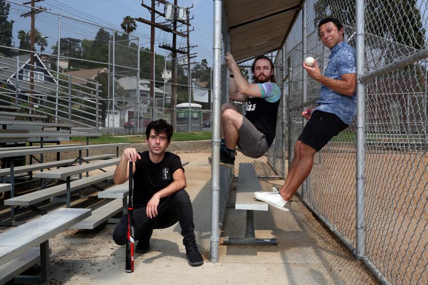 LOS ANGELES, CA - AUGUST 21: Blaseball founders Stephen Bell, Sam Rosenthal and Joel Clark, left to right, pose for a portrait in Highland Park Recreation on Friday, Aug. 21, 2020 in Los Angeles, CA. Blaseball is a free-to-play absurdist baseball simulator video game where rules and the game collide. (Dania Maxwell / Los Angeles Times)