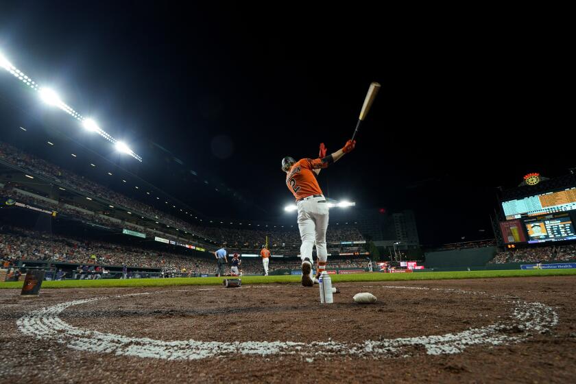 Baltimore Orioles' Gunnar Henderson swings a bat while at the on deck circle during the third inning of a baseball game against the Boston Red Sox, Saturday, Sept. 30, 2023, in Baltimore. (AP Photo/Julio Cortez)