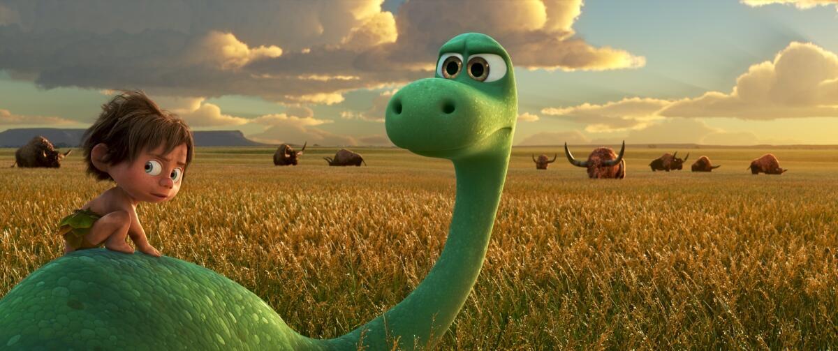 Spot, voiced by Jack Bright, left, and Arlo, voiced by Raymond Ochoa, in a scene from "The Good Dinosaur."