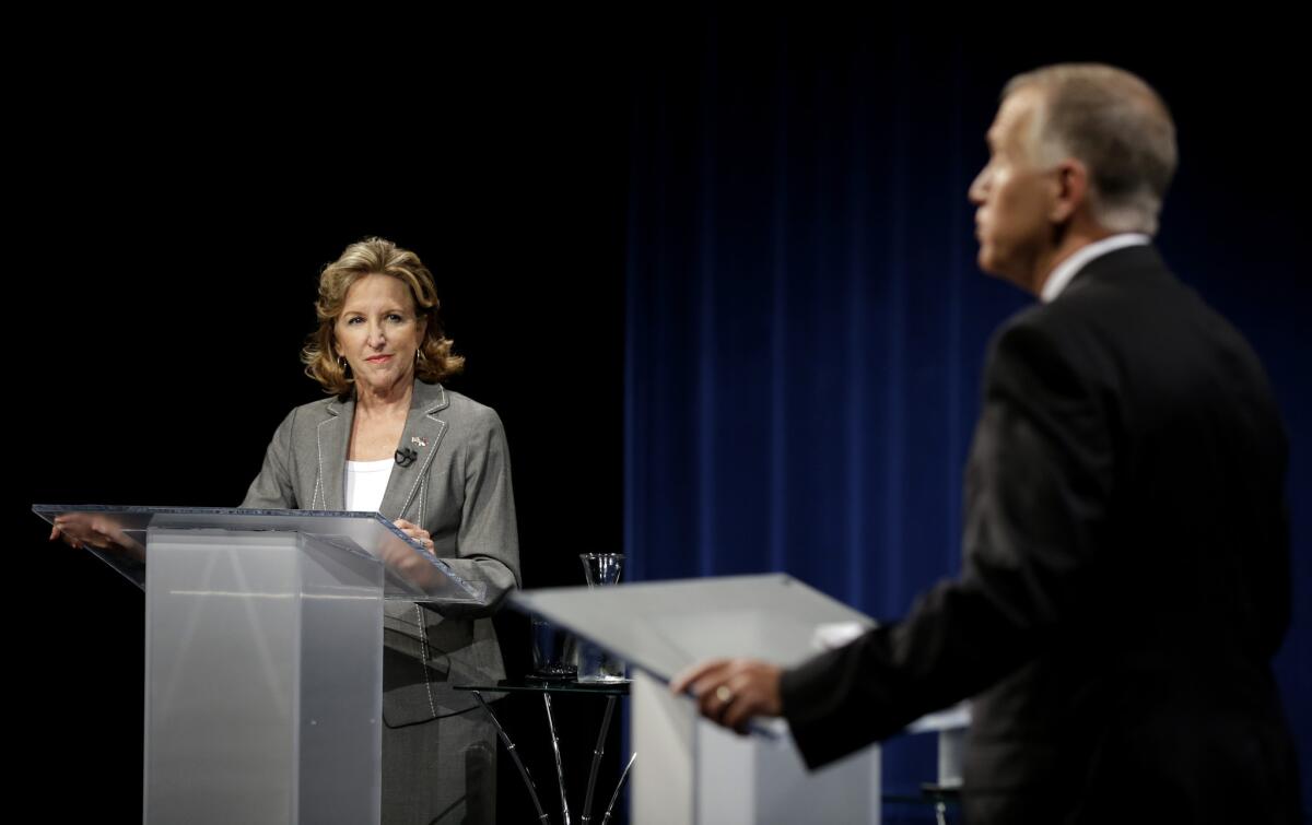 The extremely close Senate race in North Carolina between Sen. Kay Hagan (D) and Thom Tillis (R), shown here at a recent debate, is one of the handful of tossups that could determine which party controls the chamber.